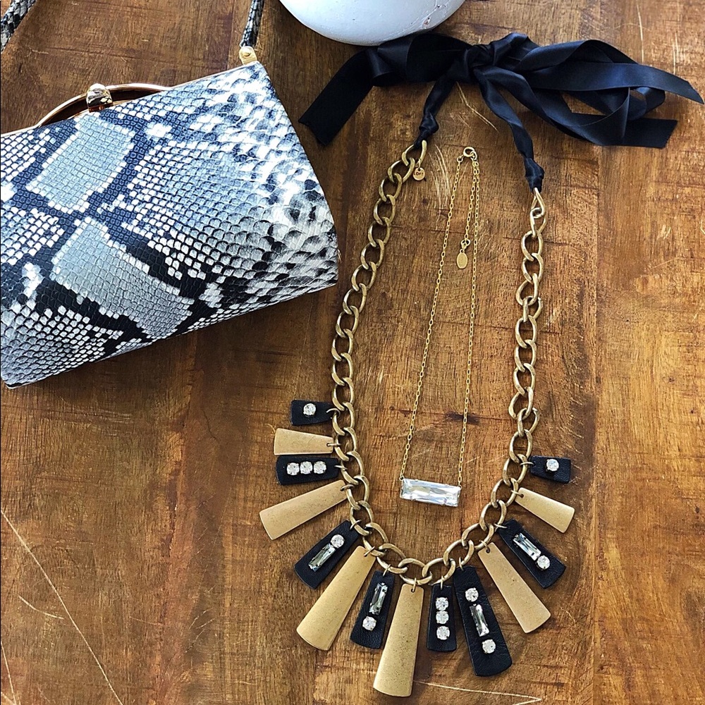 Loft Necklace, tiny bag, and necklace.